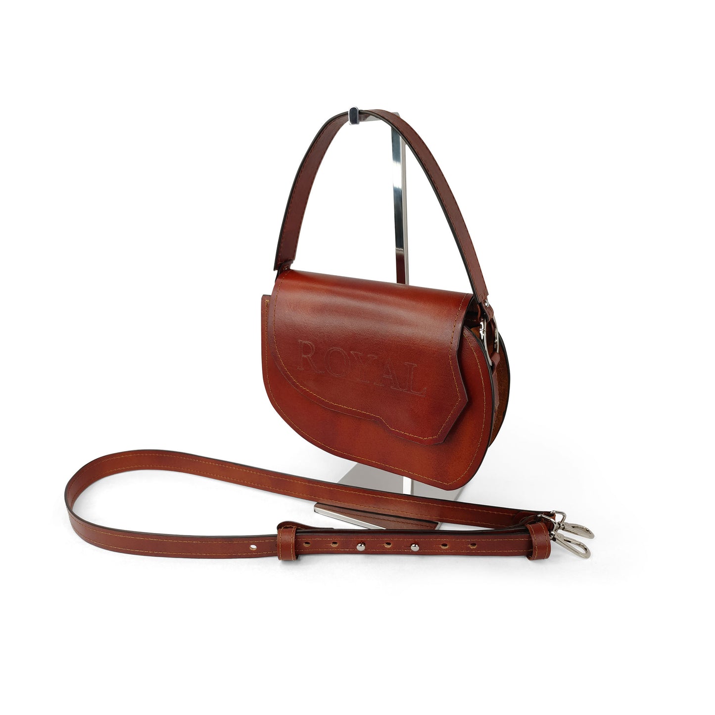 Hand‑painted full‑grain leather Grace top‑handle crossbody bag handcrafted in brown, shown in a side view displaying its smooth texture and solid color finish.