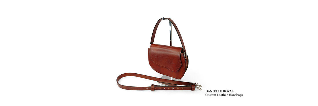 Grace full‑grain vegetable‑tanned leather crossbody bag with hand‑painted details in a refined minimalist silhouette.