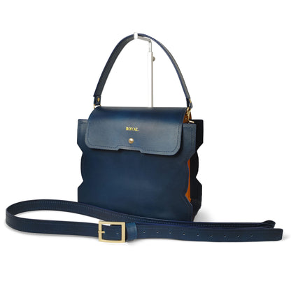 Hand‑painted full‑grain leather Bless shoulder bag satchel handcrafted in blue and orange color‑block with a top handle and strap in an elegant silhouette.  