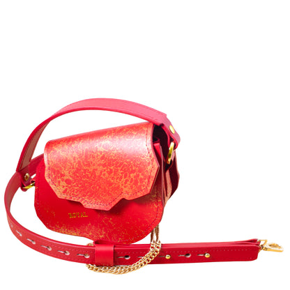 Hand‑painted full‑grain leather mini crossbody bag Charity in red with gold accents.  